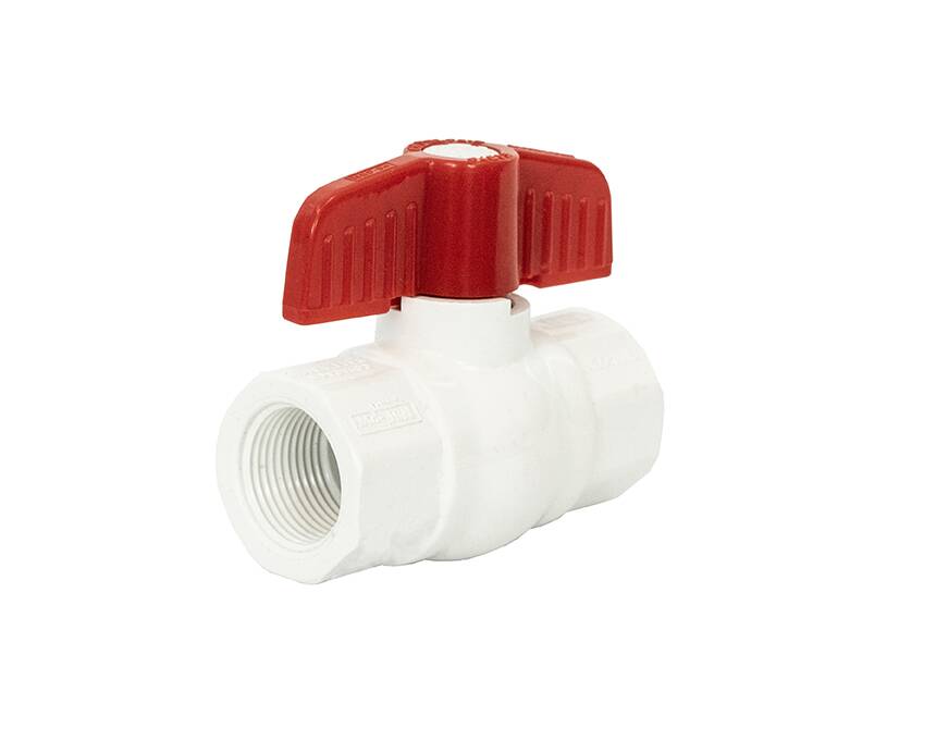t-702 - White PVC ball valve with a red lever handle, designed for plumbing. The valve is isolated on a white background, emphasizing its smooth texture.