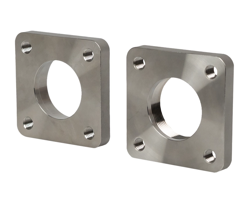 matingflanges-ss-type-b - Two metallic flange plates with a square shape and circular center holes, each featuring four corner bolt holes, displayed against a white background.