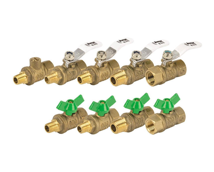 T-83CG - A row of brass ball valves with green and silver handles, arranged in two neat lines against a white background. The valves convey a utilitarian and industrial feel.