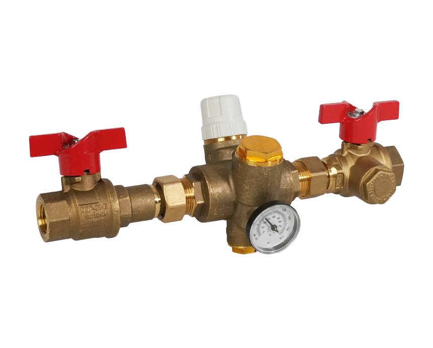 tb-120mfg - A brass plumbing valve assembly with red handles, a white plastic knob, and a pressure gauge attached, set against a plain white background.